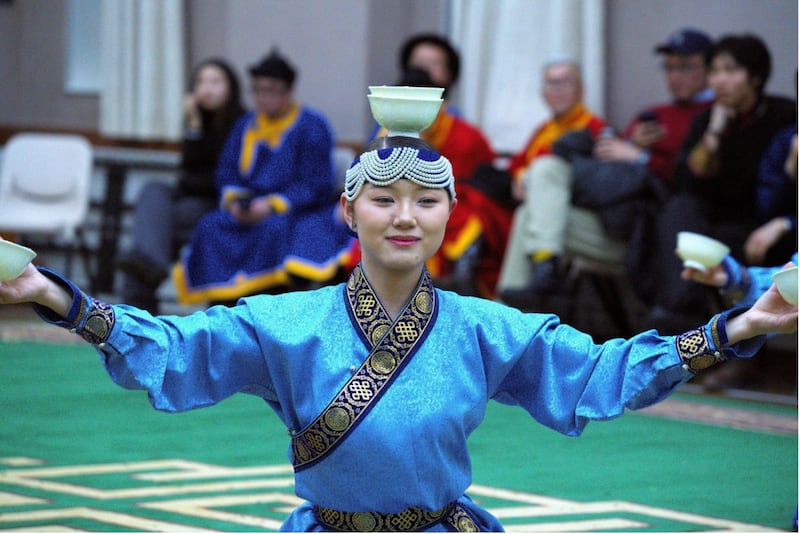 A young woman performs in traditional Mongolian dress during a Lunar New Year and family history celebration in Mongolia on Feb. 14, 2026.