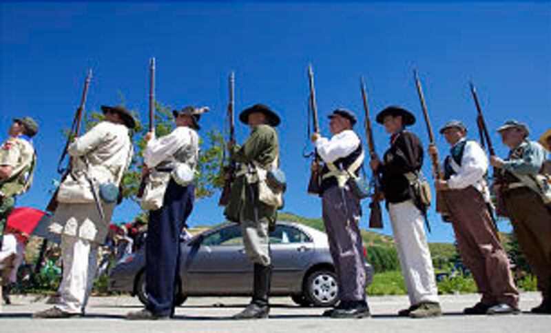Men representing Mormon Battalion soldiers line up for presentation of colors at dedication ceremony