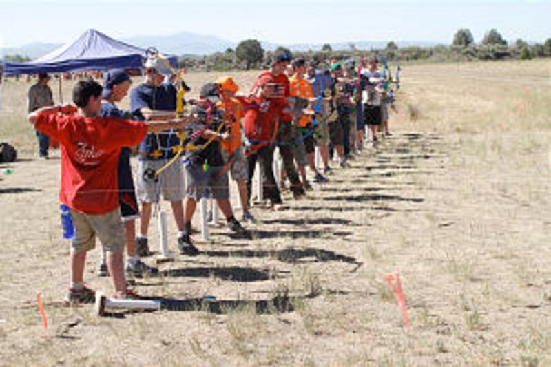 Boy Scouts polish their archery skills at the 2013 Rise Up Scout Camp.