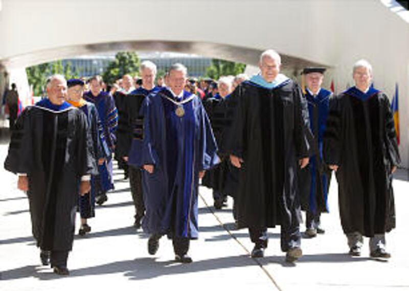 Elder Ronald A. Rasband and President Cecil O. Samuelson at BYU graduation on August 15, 2013.