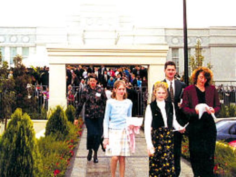 Members leave Perth temple after dedication. Temple is among most distant from Church headquarters.