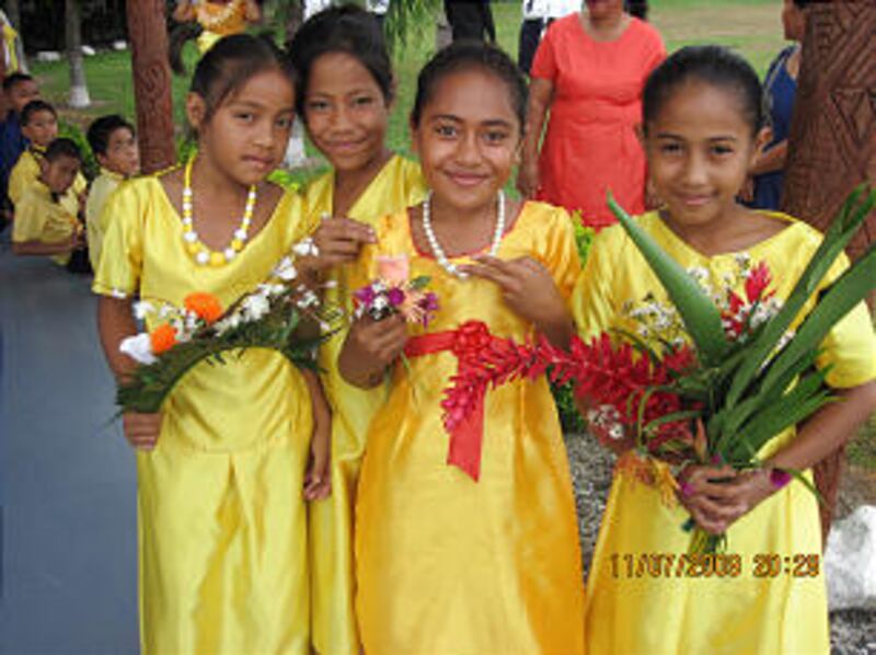 Primary girls wait to present flowers to President Dieter F. Uchtdorf and Sister Harriet Uchtdorf up