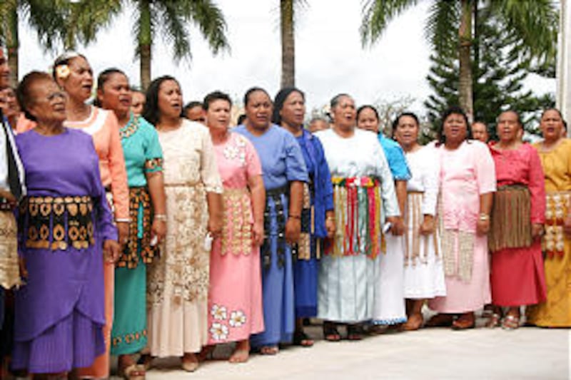 Latter-day Saint women participate in the cornerstone ceremony of the Nuku'alofa Tonga Temple rededi