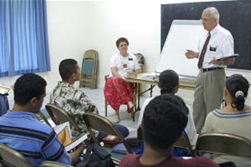 Senior missionaries, Sister Sylvia Biggs and Elder Jack Biggs, teach institute class.