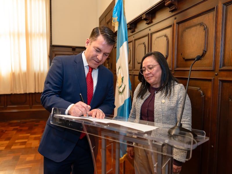 Elder Gregorio Casillas, a member of the Central America Area Presidency of The Church of Jesus Christ of Latter-day Saints, signs the deed of donation for the generator along with the Vice Minister of Hospitals, María del Rosario Orozco in Guatemala on Feb. 2, 2026.