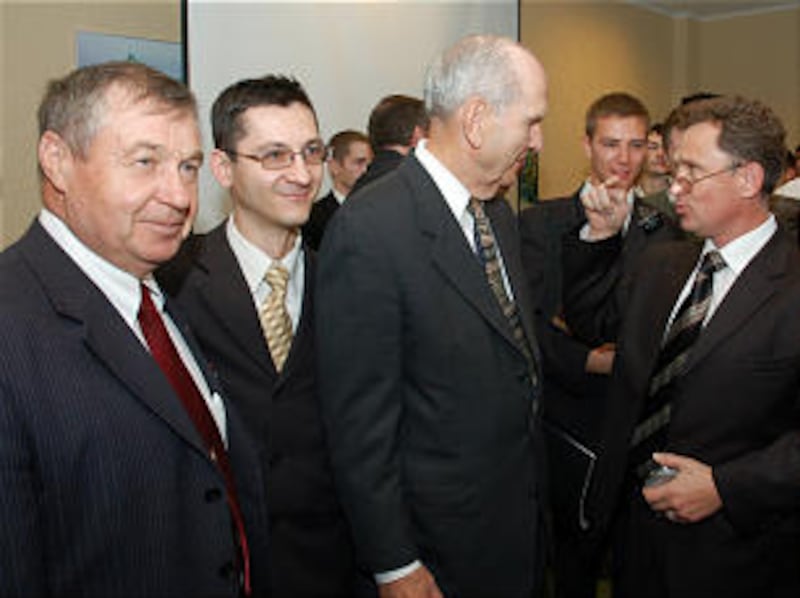 Elder Russell M. Nelson converses with priesthood leaders at the conference.