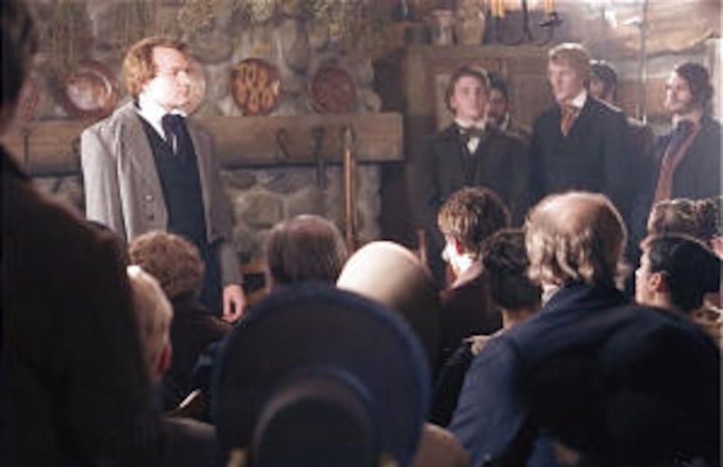 Nathan Mitchell, left, portrays the Prophet Joseph Smith at the Whitmer farm April 6, 1830, in scene