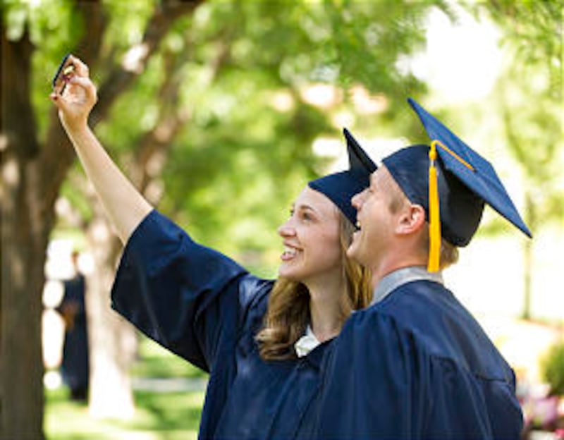 BYU Graduates take photos before the Summer Commencement exercises.