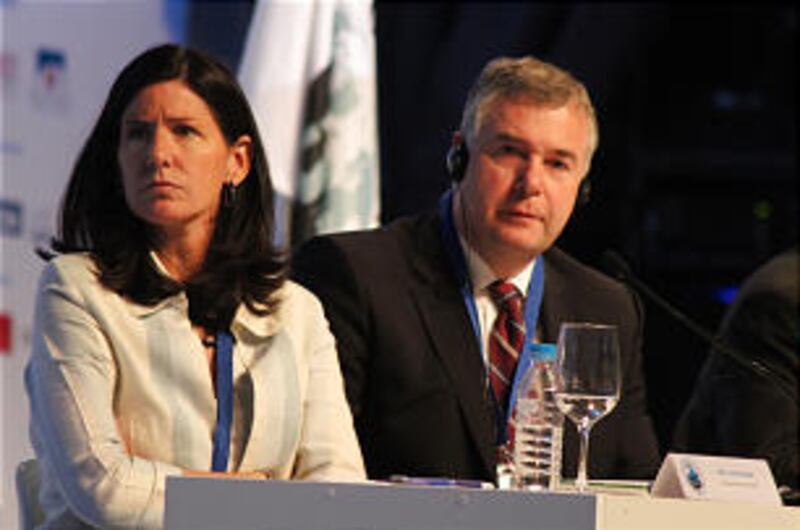 Seated during opening session of the congress are Lola Velarde, left, Elder Erich W. Kopischke of th