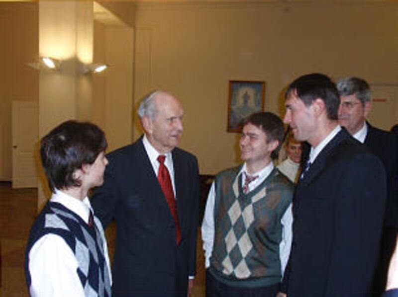 Elder Russell M. Nelson poses with members following the dedication of the Voronezh Branch meetingho