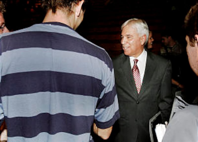 Elder Claudio RM Costa greets BYU students after he spoke at a BYU devotional.