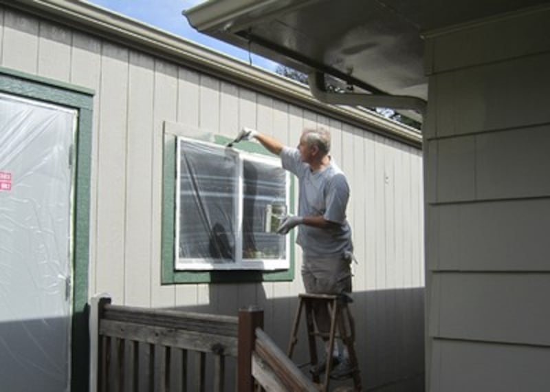 Bishop Gunnell paints Lake Stevens city office.