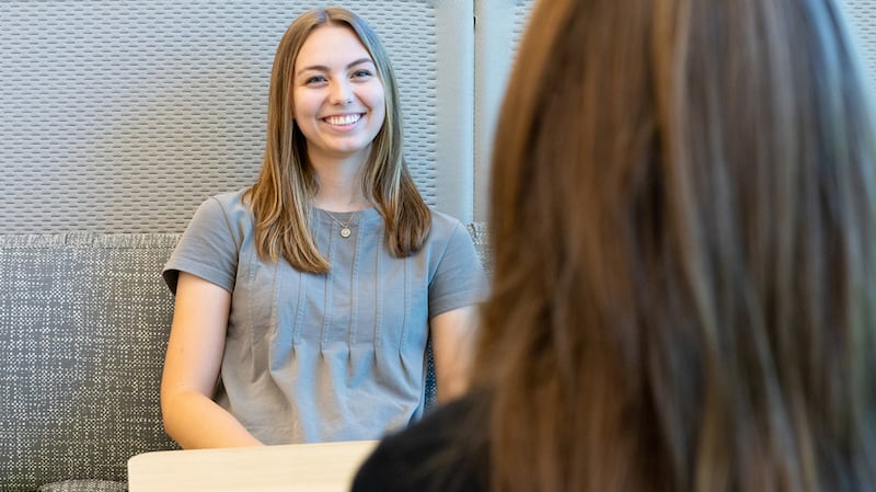 Institute students visit together at the Logan Utah Institute of Religion.