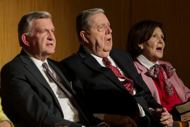 From left to right, Provo MTC President Benson L. Porter, Elder Jeffrey R. Holland of the Quorum of the Twelve Apostles and Sister Patricia Holland sing a hymn during a devotional at the Provo Missionary Training Center in Provo, Utah, on Tuesday, May 10, 2022.