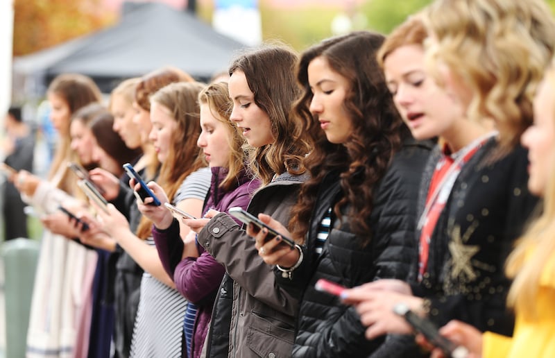 Attendees sing outside Temple Square during the 188th Semiannual General Conference of The Church of