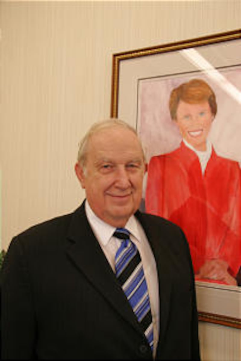 Elder Richard G. Scott stands by painting he did of his wife, Jeanene, who passed away in 1995.