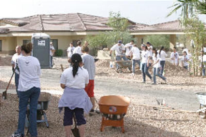 Gilbert Arizona stake youth join youth from the Catholic Church to perform community service. Youth