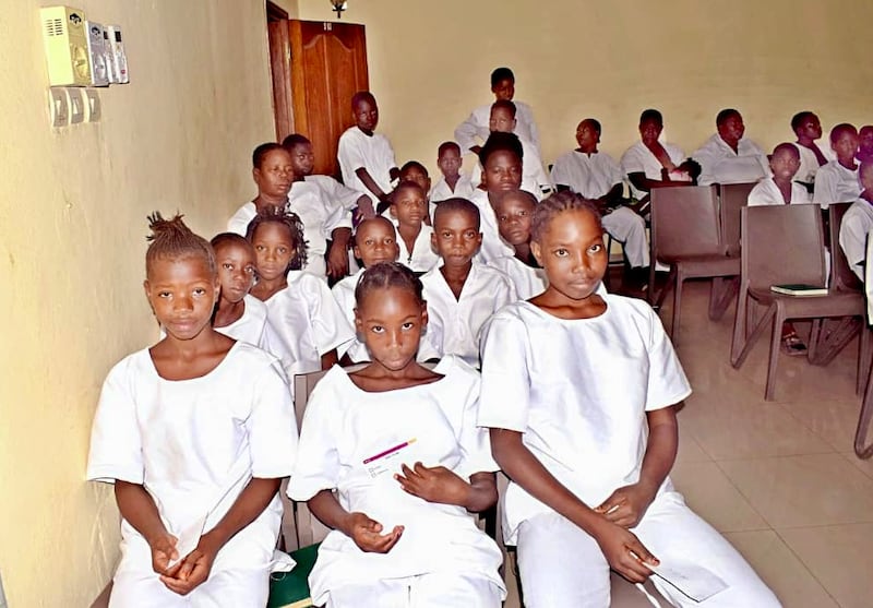 Youth dressed in white wait for their turn to be baptized in Bamako, Mali, on Saturday, April 18, 2026.