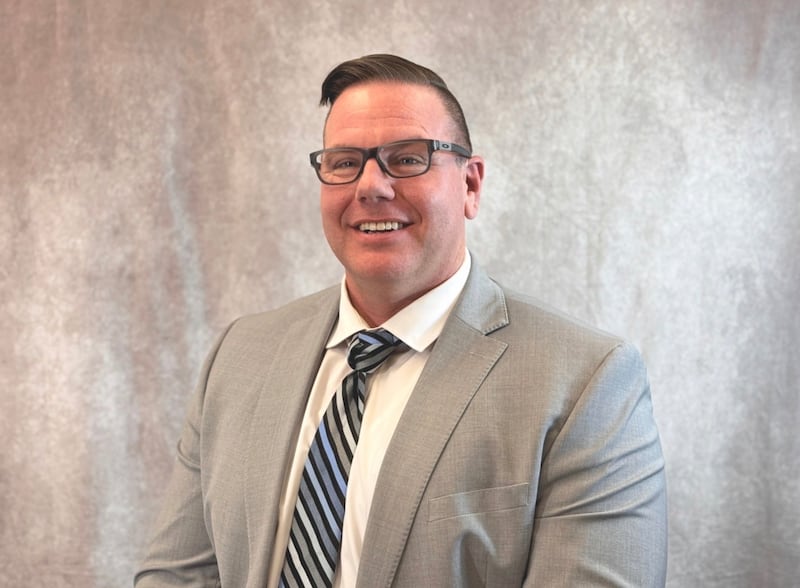 Mark Thornton, program manager for Deseret Industries, smiles for a photo.