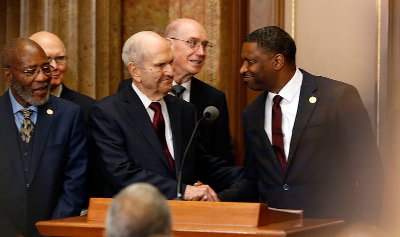 President Russell M. Nelson of The Church of Jesus Christ of Latter-day Saints shakes hands with Nat