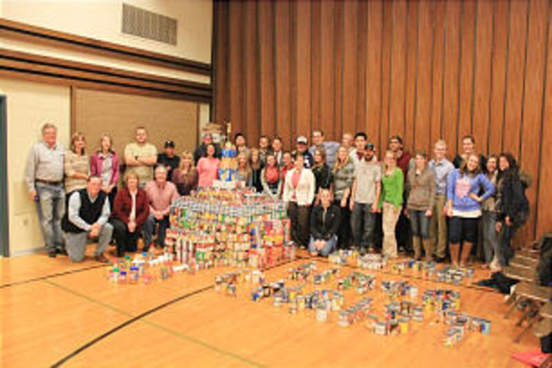 Members of the Sandy Heights YSA Ward pose with their sculpture.