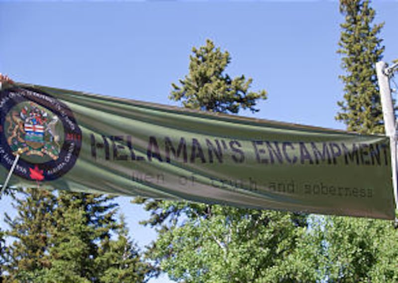 The banner welcoming all to "Helaman's Encampment" was stretched across the LDS Scout camp in wester