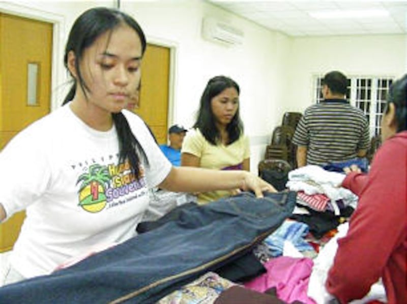 Rae Deanne Fajardo, left, and Sheryl Garcia, young single adults of the Paranaque Philippines Stake,