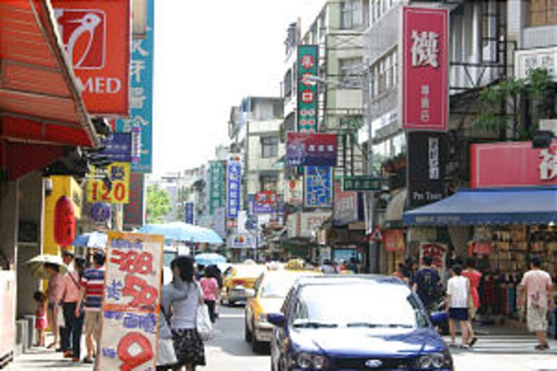 A typical street near the Church's temple in Taipei, a city of about 2.6 million, is alive with acti