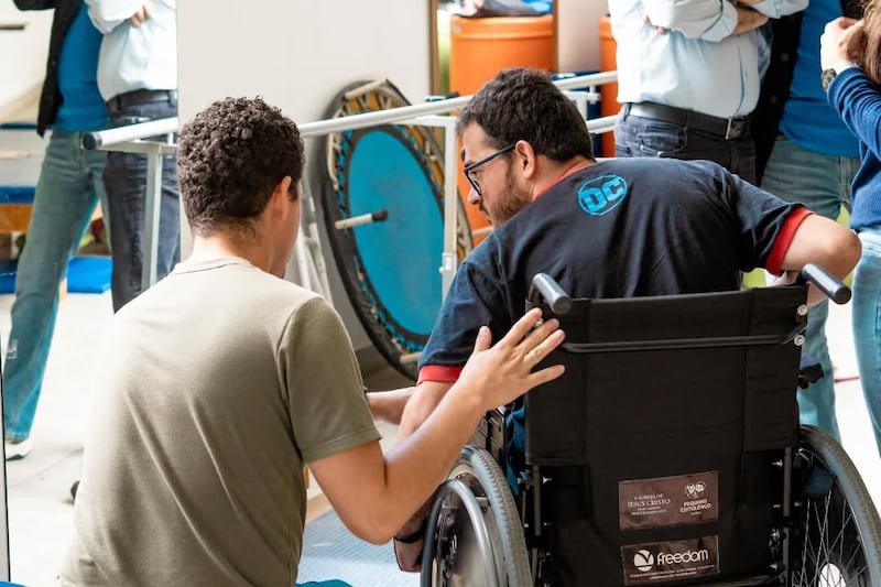 A man receives a wheelchair from Pequeno Cotolengo Paulista in Cotia, Brazil. The Church of Jesus Christ of Latter-day Saints will begin a long-term donation of 300 wheelchairs to Pequeno Cotolengo Paulista in spring 2025.