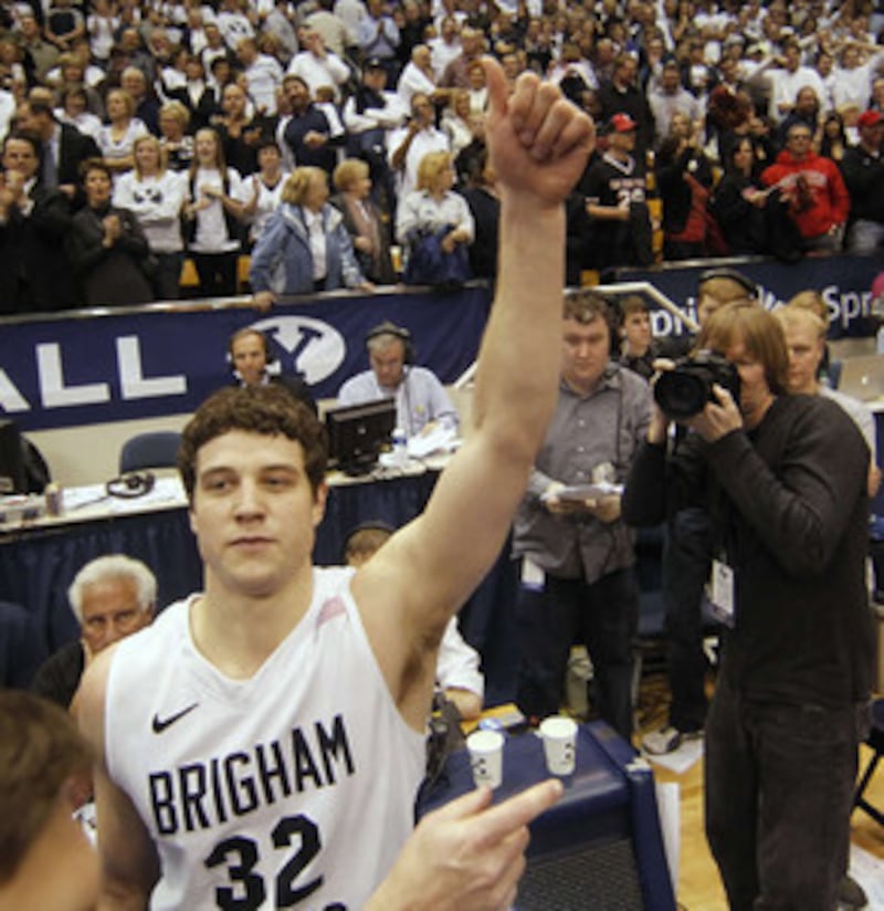 BYU's Jimmer Fredette celebrates after BYU's win over San Diego State's at an NCAA college basketbal
