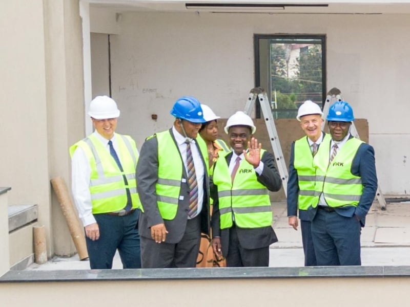 Elder Edward Dube waves with area leaders on a tour of the new Africa Central Area office building under construction in Nairobi, Kenya, April 25, 2026.