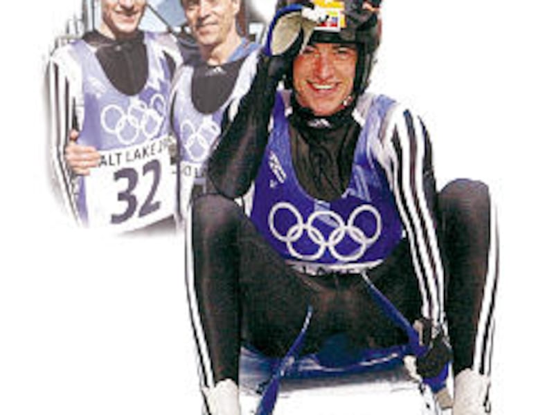 Chris Hoeger and his father, Werner, bask in the euphoria of completing their best luge slides durin