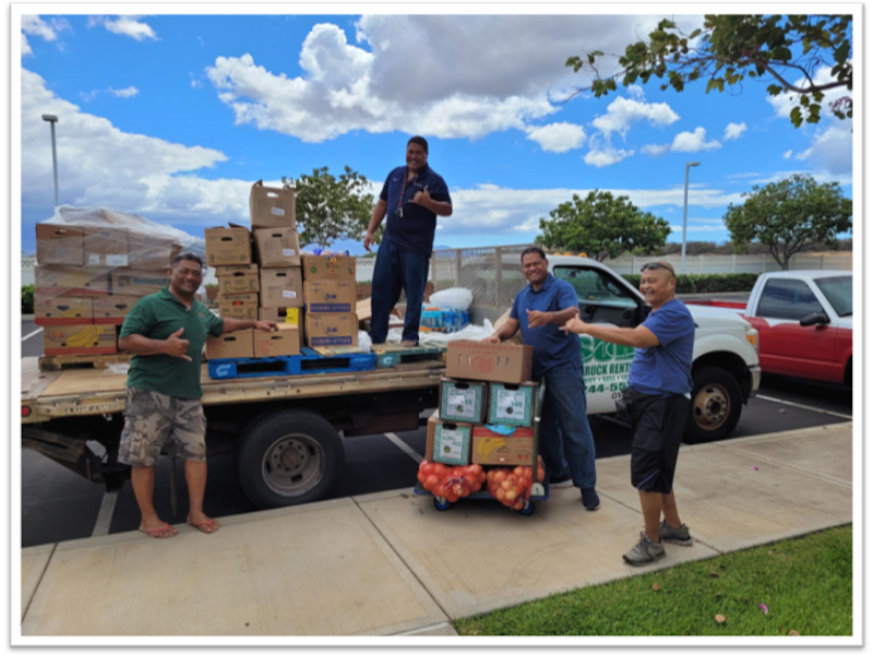 Volunteers unload groceries for the Maui Satellite Bishops’ Storehouse in Kahului on the island of Maui, Hawaii