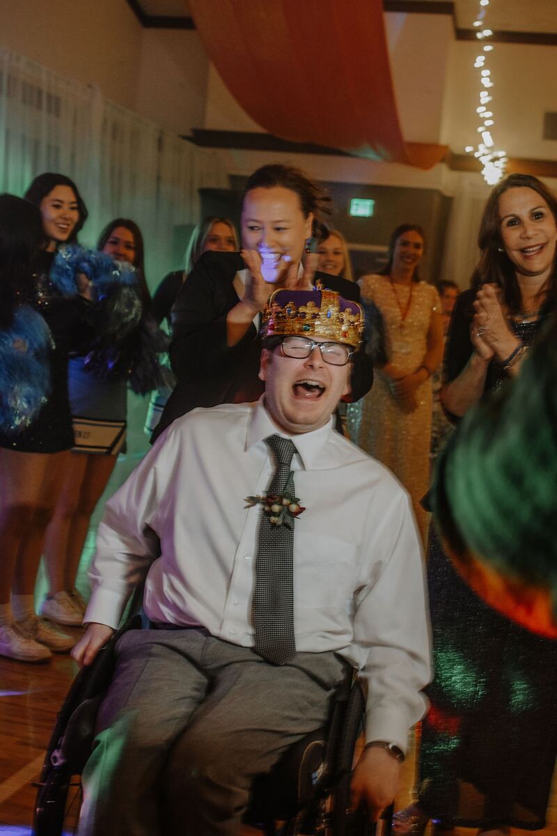 Andrew Skouson, in a wheelchair, is dubbed king of the Dazzle Prom in Las Vegas, Nevada.
