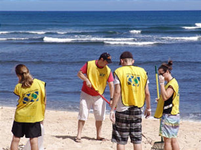 Members of Mililani Oahu Stake clean Kaiaka Beach State Park in Hawaii as part of Mormon Helping Han