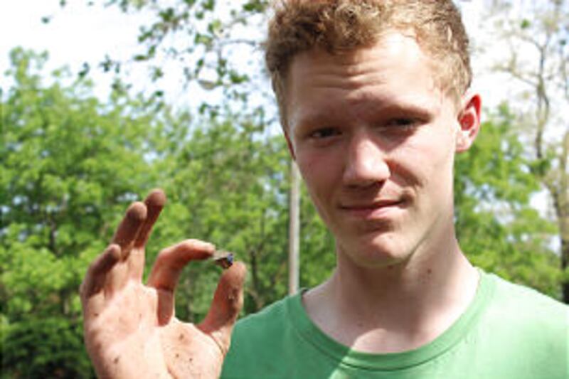 James Johnson finds a tiny shard from the site of the cabin where Joseph Smith Sr. and Lucy Mack Smi