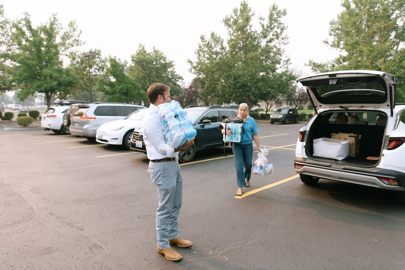 Members of the Spokane Washington Stake bring supplies to the stake center for people affected by the wildfires in Spokane, Washington, on Aug. 2, 2026.