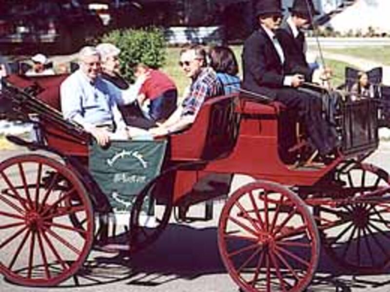 As honorary marshal of centennial parade June 30 in Raymond, Alberta, Elder M. Russell Ballard, left