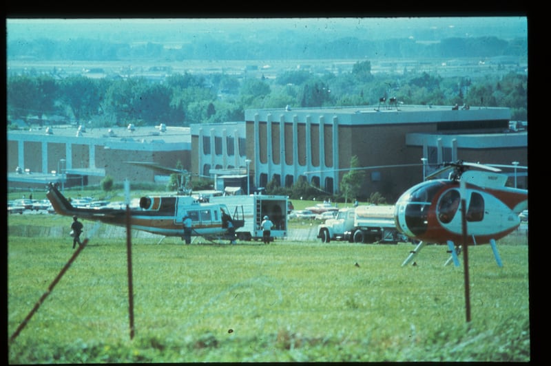 The command center with emergency vehicles is set up above Ricks College following the collapse of the Teton Dam in June 1976.