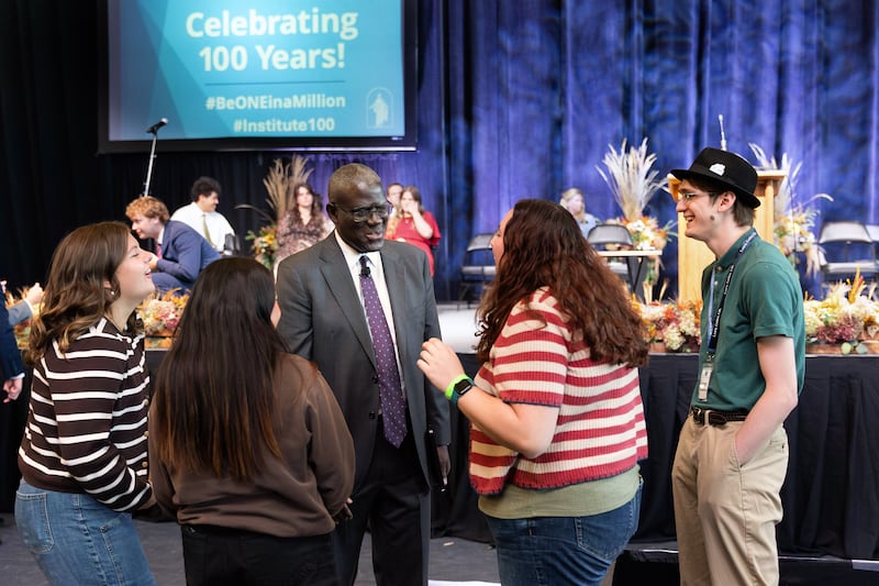 Elder Peter M. Johnson, a General Authority Seventy, speaks with young adults prior to a "100 years of institute" commemorative devotional held in the ICCU Arena on the University of Idaho campus in Moscow, Idaho, on Saturday, Sept. 26, 2026.