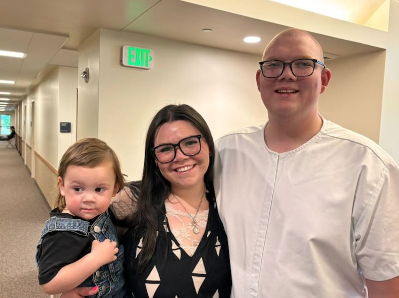 Cambrie and Jadrian Taylor, together with their son Jadrian Jr., celebrate together moments before Jadrian's baptism, San Tan Valley, Arizona, April 21, 2024.