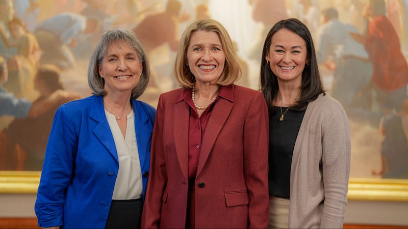 Relief Society General President Camille N. Johnson stands with her counselors, Sister J. Anette Dennis, left, and Sister Kristin M. Yee, in the Conference Center in Salt Lake City.