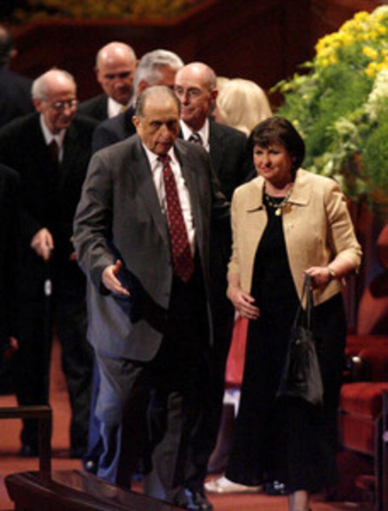 President Thomas S. Monson escorts his daughter, Sister Ann M. Dibb, who is second counselor in the