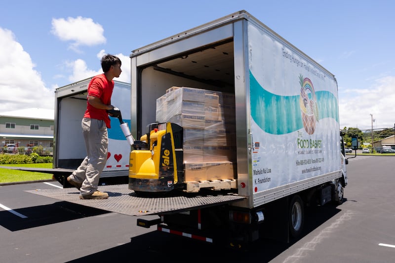 Members of The Church of Jesus Christ of Latter-day Saints unload food donations from the Church in Hilo, Hawaii, on June 13, 2026. Hawaii is the 50th state to receive a donation in honor of the 250th anniversary of the United States.