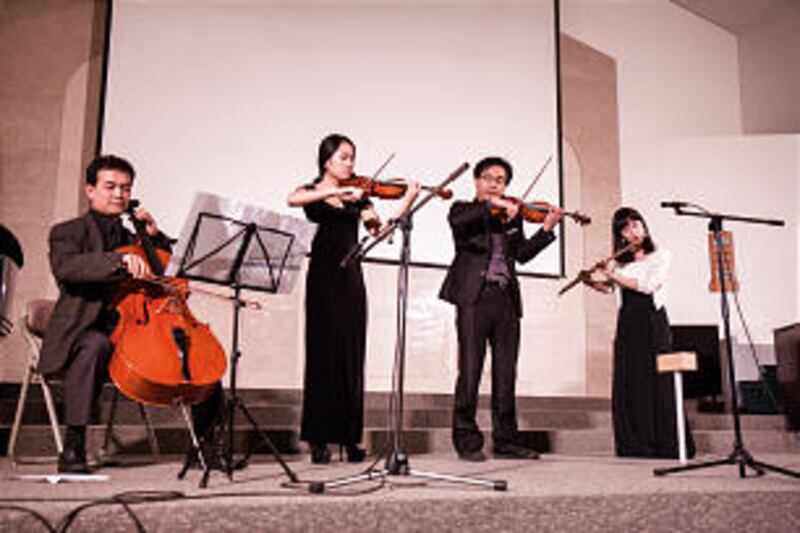 Performers BooMin Do, cello; SunGee Lee, violin; JongHun Kim, violin and JeeUn Pak, flute, at the Ko