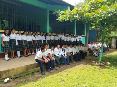 Students and teachers at one of the schools where the SOYLA Foundation sponsors scholarships in Guatemala pose for a group photo.