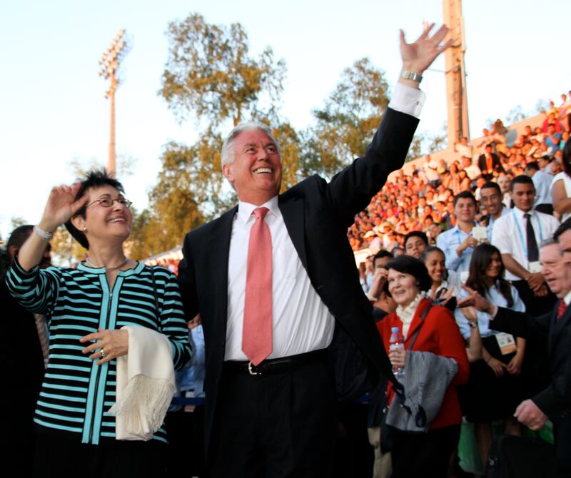 Elder Dieter F. Uchtdorf and Sister Harriet Uchtdorf salute the crowd as the arrive for the March 16, 2013, Honduran cultural celebration.
