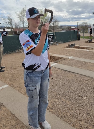 Adilaide Ohms, 18, pitches a horseshoe during the April 2026 high school horseshoe season.