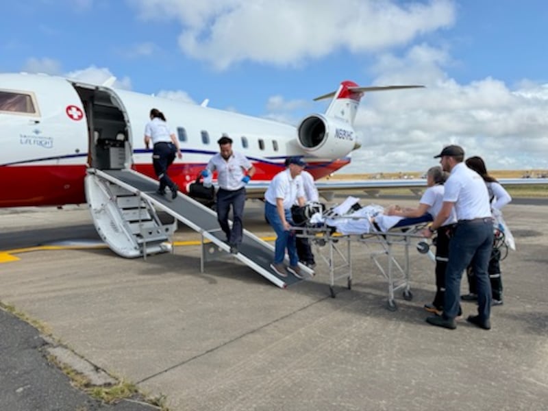 Intermountain Health flight crew members load Estelle Santiago, then 3 years old, onto a medical flight in Uruguay in January 2026.