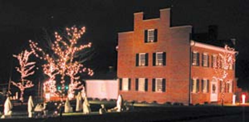 Motorists passing historic Kirtland are greeted with this inviting view of a Nativity scene set amon